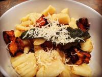 Pan Fried Gnocchi with Roast Pumpkin and Burnt Sage Butter. Topped with parmesan cheese.